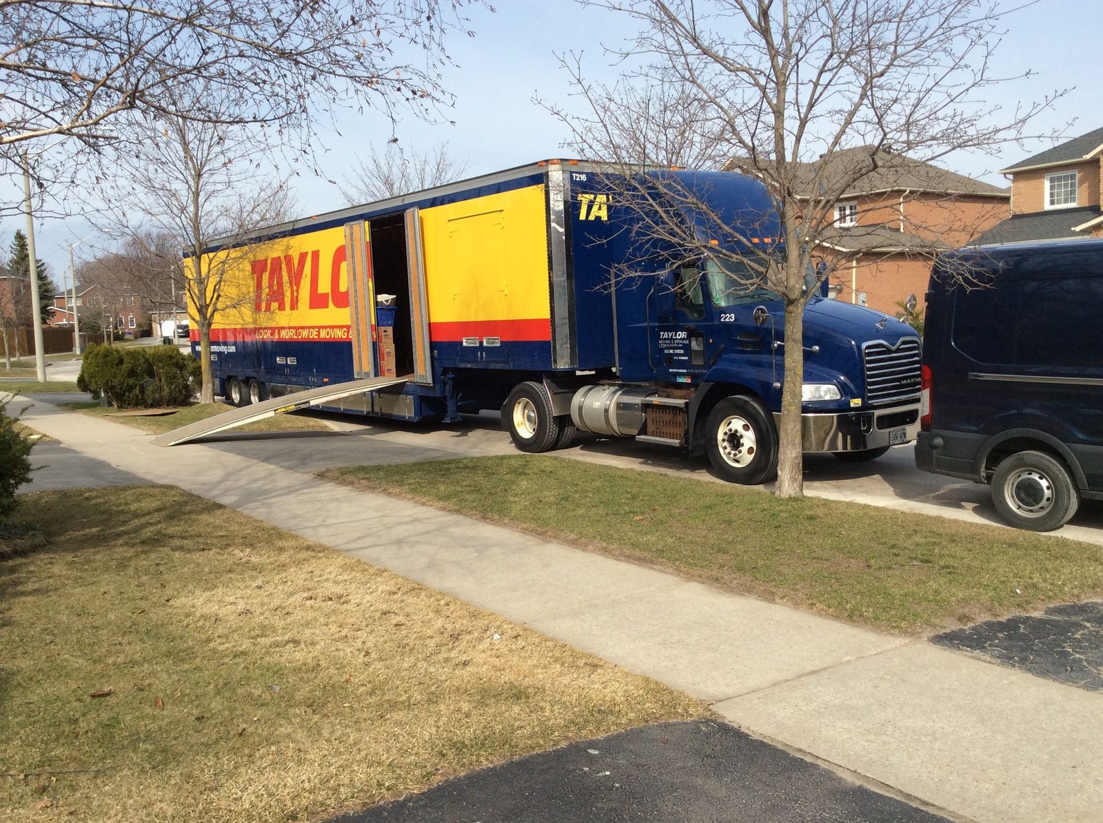 A real Taylor Moving truck on a residential delivery, the company Wayfinder was built inside